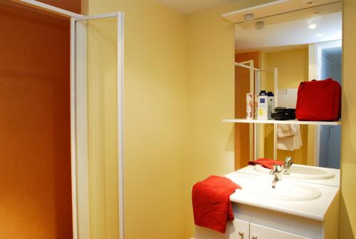 a bathroom with a sink and a shower at VVF Dordogne Lot in Gluges