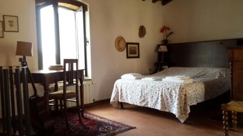 A bed or beds in a room at Casina in pietra
