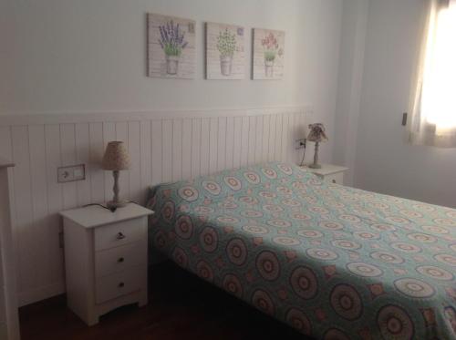 En eller flere senge i et værelse på Alcalá de la Selva Apartamento