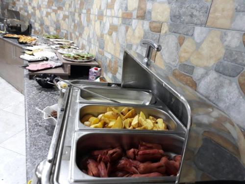 a bunch of food in a sink in a kitchen at Mevlana Palace in Konya