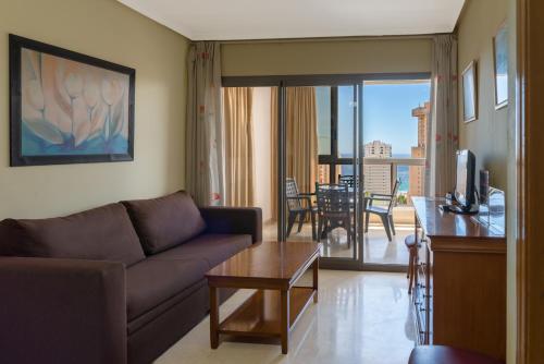 a living room filled with furniture and a window at Gemelos 20 - Beninter in Benidorm