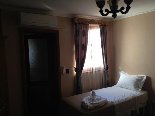 Hotel Vila Manoにあるベッド