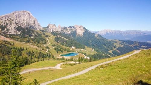 a view of a mountain with a lake in the middle at Apartment Bergjuwel in Sonnenalpe Nassfeld