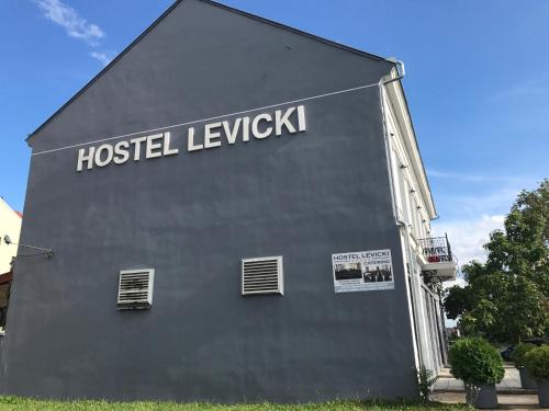 a building with the words hostel leyk on it at Hostel Levicki in Slavonski Brod