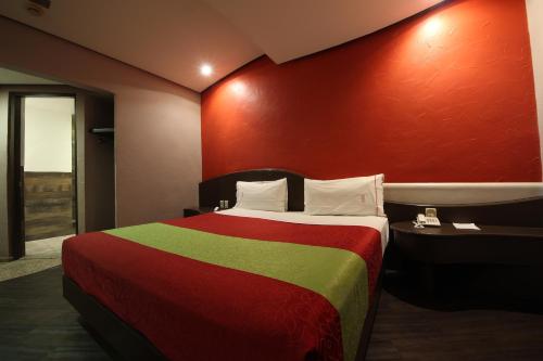 Postel nebo postele na pokoji v ubytování Hotel y Villas Vento