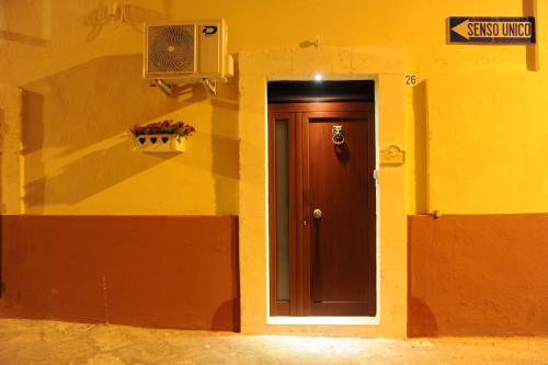 a door in the side of a building at Palazzo Savoia 1856 in Fasano