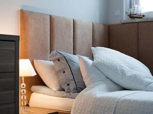 Amko Style Apartamenty Nadmorski 60 Willa Nord tesisinde bir odada yatak veya yataklar