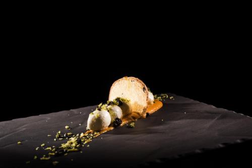 a piece of food sitting on top of a plate at Linder Cycling Hotel in Selva di Val Gardena
