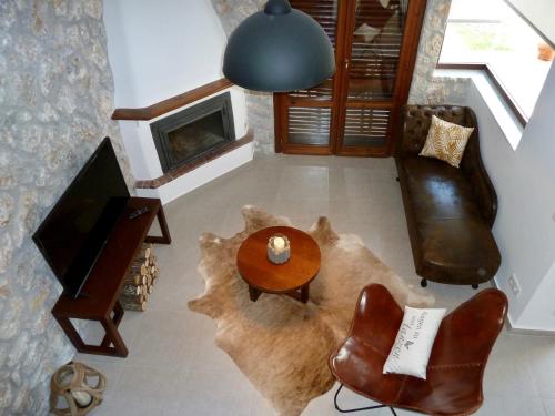TV a/nebo společenská místnost v ubytování Beach House Nikiti