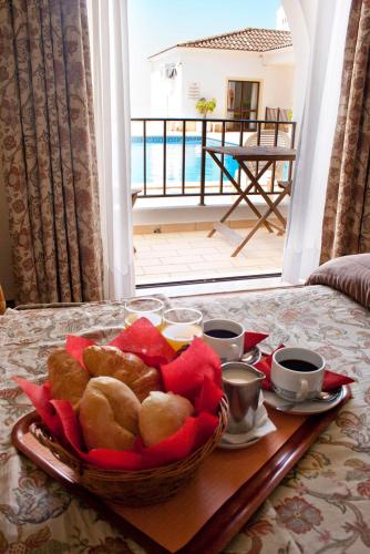 a basket of bread on a table in a room at Alte Hotel in Alte