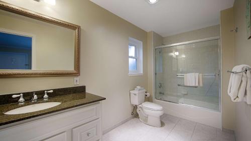 a bathroom with a sink and a toilet and a shower at Carmel Bay View Inn in Carmel
