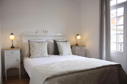 En eller flere senge i et værelse på Molarinho Heritage