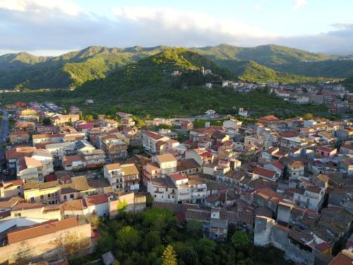 an aerial view of a city with houses and mountains at Casa Catena in Francavilla di Sicilia