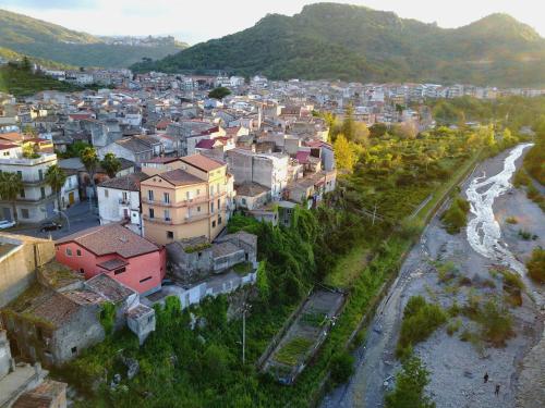 an aerial view of a town next to a river at Casa Catena in Francavilla di Sicilia