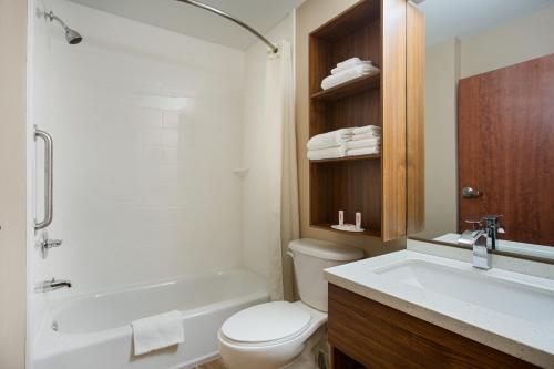 A bathroom at Microtel Inn & Suites by Wyndham Walterboro