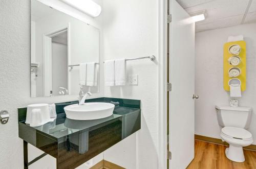 a bathroom with a sink and a toilet at Motel 6-Big Springs, NE in Big Springs