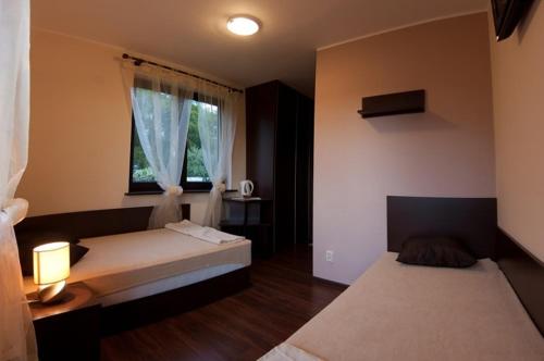 Cama o camas de una habitación en Dom Gościnny Morska Perła