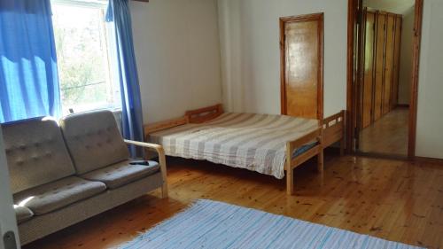 Un ou plusieurs lits dans un hébergement de l'établissement Saimaa Hirsilinna Anttola