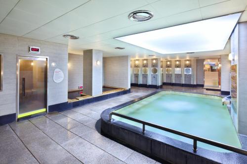 a large swimming pool in a bathroom with a pool at Hanwha Resort Gyeongju in Gyeongju