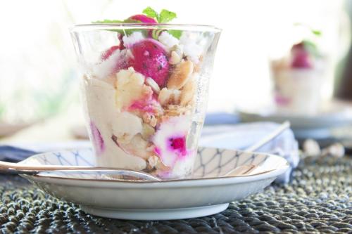 a cup of dessert on a plate with a spoon at Villa Pulau Cinta Boutique Suites in Gili Meno