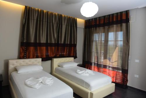 Voodi või voodid majutusasutuse Villamaria Hotel toas