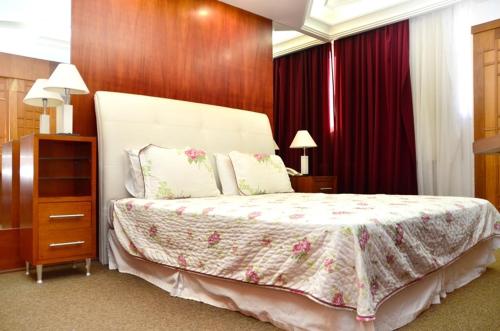 מיטה או מיטות בחדר ב-Pekin Palace Hotel