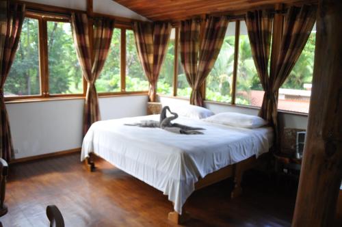 Postel nebo postele na pokoji v ubytování Casa Aba Matapalo