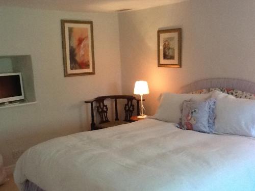 Katil atau katil-katil dalam bilik di Swan Cottage