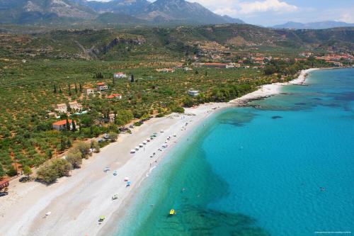 an aerial view of a beach and the ocean at Notos Hotel Kardamili in Kardamili