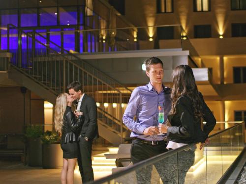a group of people standing on a staircase at Atlantida Boutique Hotel in Rogaška Slatina