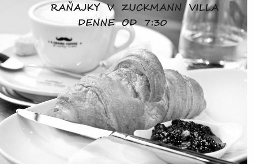 a black and white photo of a sandwich on a plate at Zuckmann Villa in Piešťany