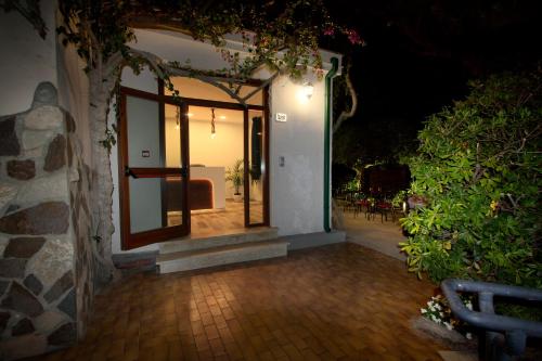 an outside entrance to a building with a glass door at Hotel Rio Claro in Fondi