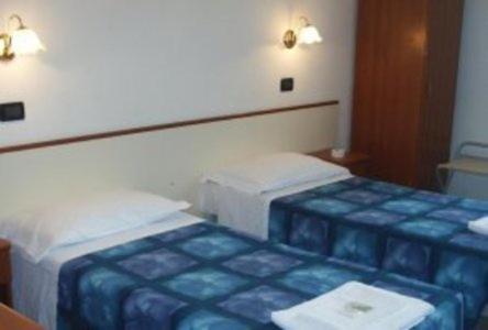 Ένα ή περισσότερα κρεβάτια σε δωμάτιο στο Serafino Liguria Hotel