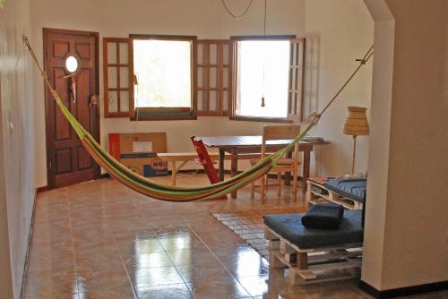 a living room with a hammock in a room at Private Holiday Apartment in Tarrafal