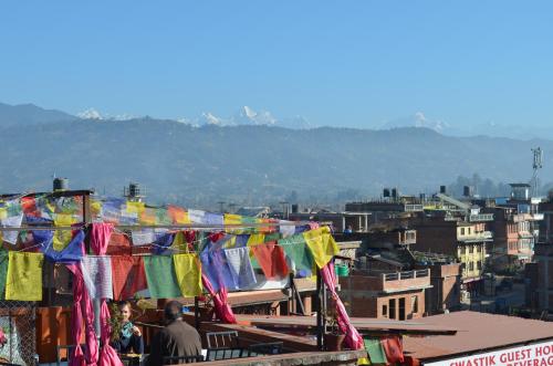 a view of a city with prayer flags at Swastik Guest House in Bhaktapur