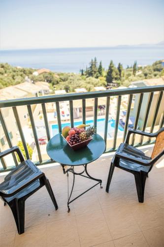a bowl of fruit on a table on a balcony at Corfu Aqua Nisaki in Nisakion