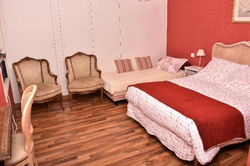 Ένα ή περισσότερα κρεβάτια σε δωμάτιο στο Chambres d'Hôtes l'Hermine