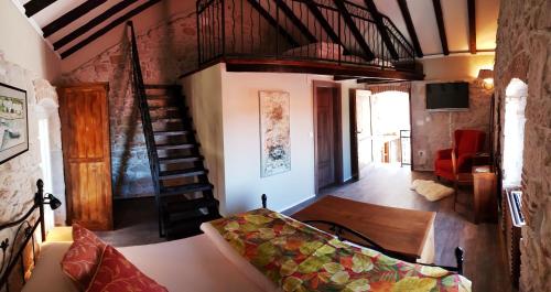 a living room with a staircase and a couch at Villa Cherie in Sutomišćica