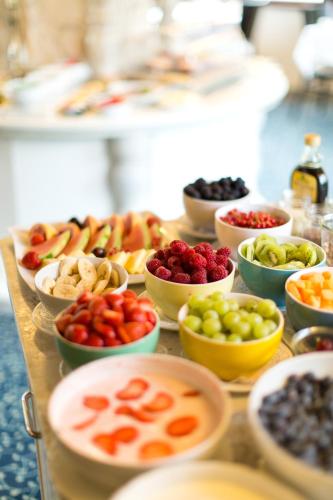 a table full of different types of fruits and vegetables at Hotel Garni Römerhof in Innsbruck