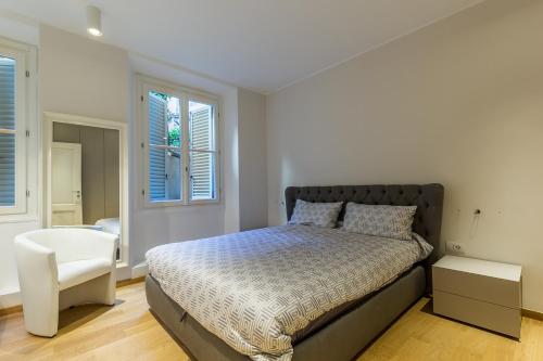 מיטה או מיטות בחדר ב-Fifty Eight Suite Milan