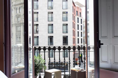 a view of a building from a window at DestinationBCN - Universitat Rooms in Barcelona