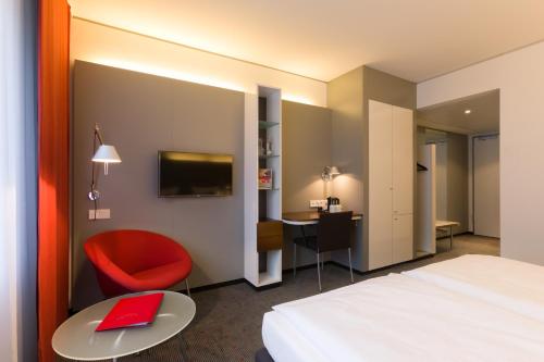 Vienna House Easy by Wyndham Stuttgartにあるベッド