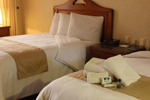 Hotel San Antonioにあるベッド