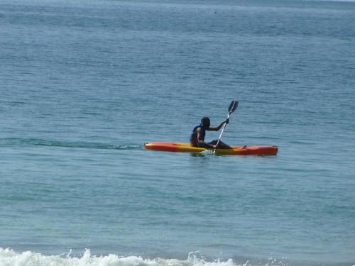 a person sitting on a kayak in the water at Plantation Beach Villas in Black Rock
