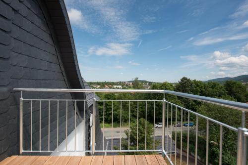 a balcony with a view of a parking lot at LIONO BoutiqueHotel in Goslar