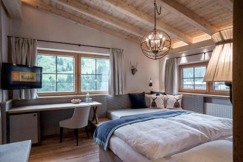 A bed or beds in a room at Aktiv- & Wellnesshotel Bergfried