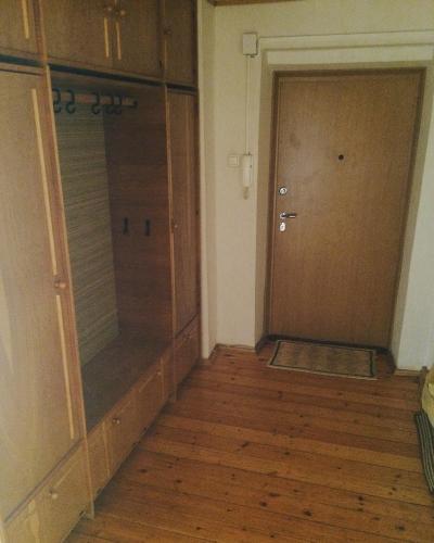 an empty room with a closet and a door at Jolando Apartment in Kaunas