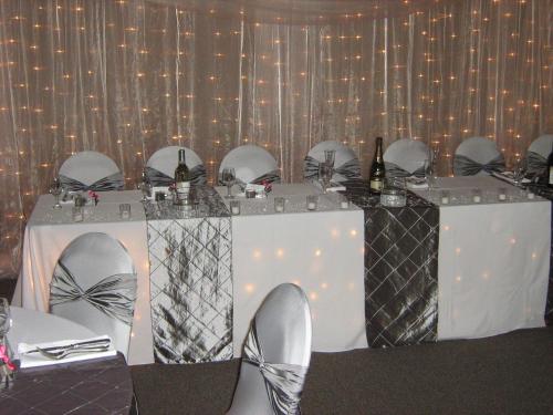 a table with mirrors and skis on top of it at The Cedars Inn Hotel & Convention Centre in Gibsons