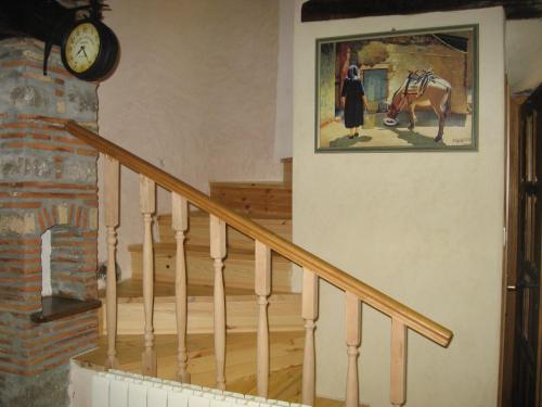 a staircase with a painting of a woman and a horse at Antonia & Arian in Roč