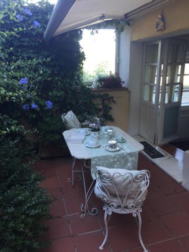 a table and a chair on a patio at Calycanto in Tempio Pausania
